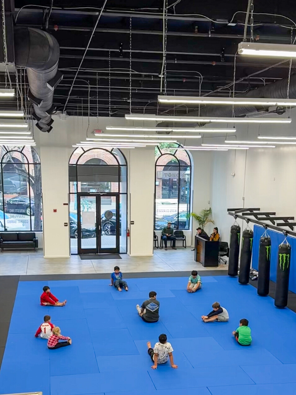 Young students training together in a class at Spartan Combat Sports